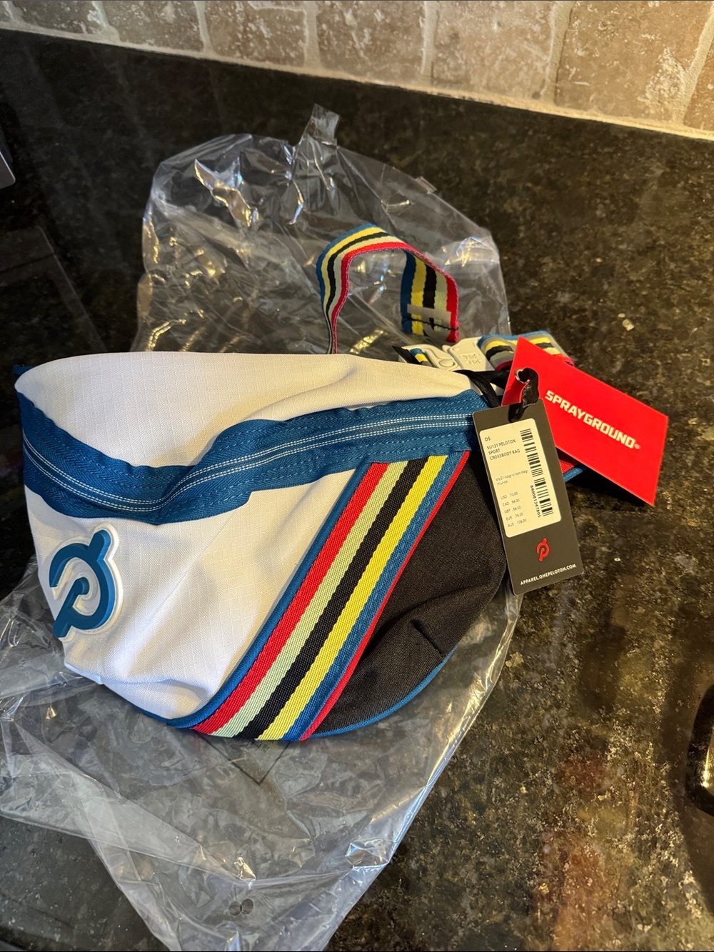Peloton White and Blue Waist Bag with Multicolor Stripe Accent